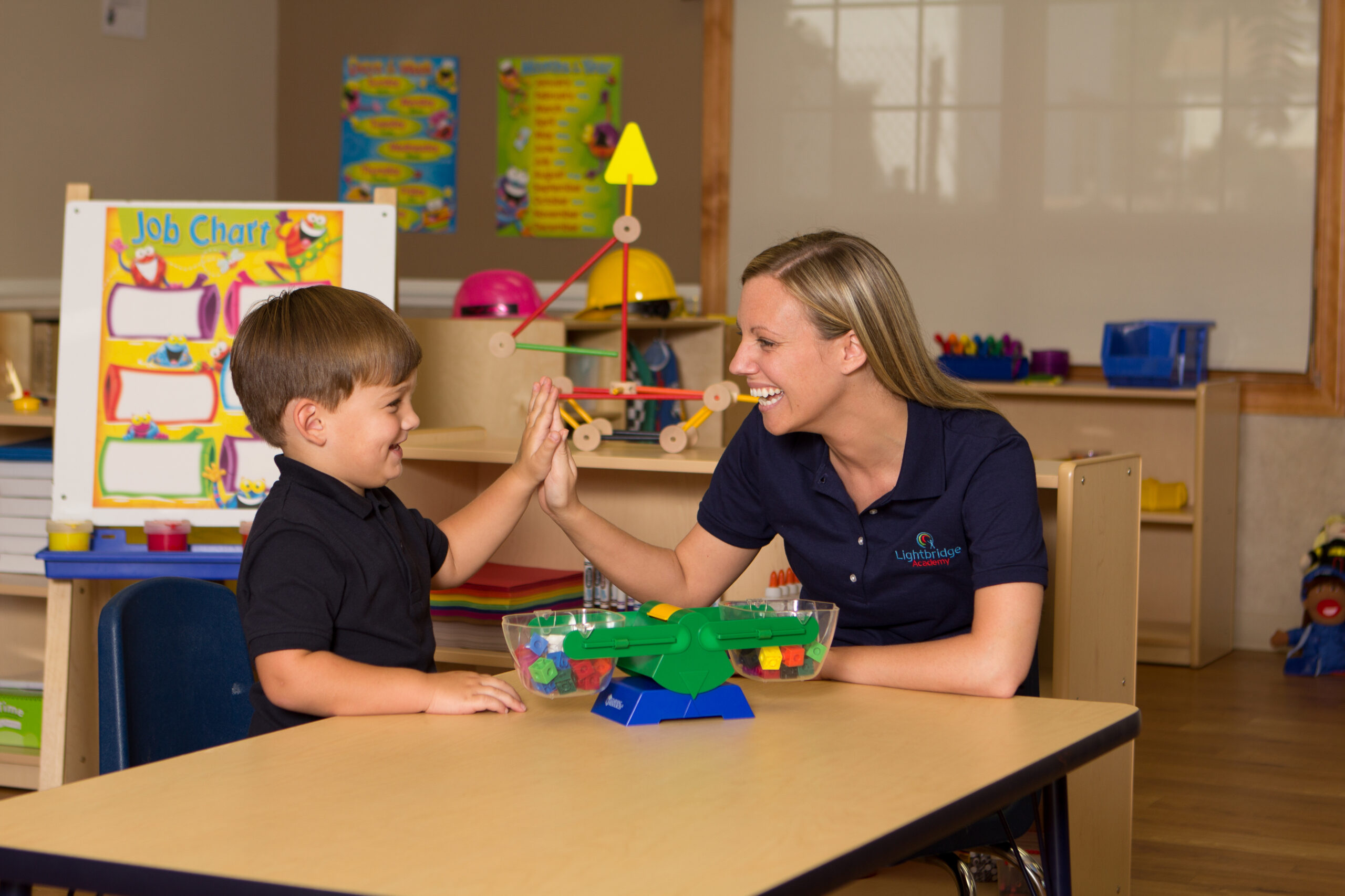 Child and teacher at daycare franchise