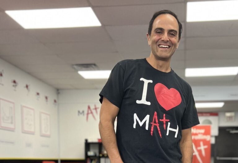 Multi-unit franchisee Sam Younis wearing an I love Math shirt in one of his centers.