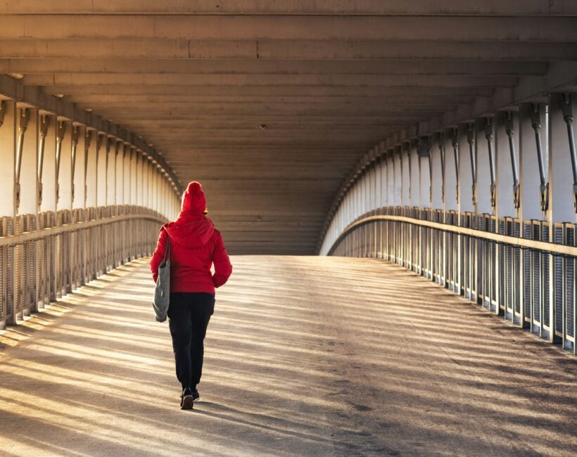 woman walking on a bridge
