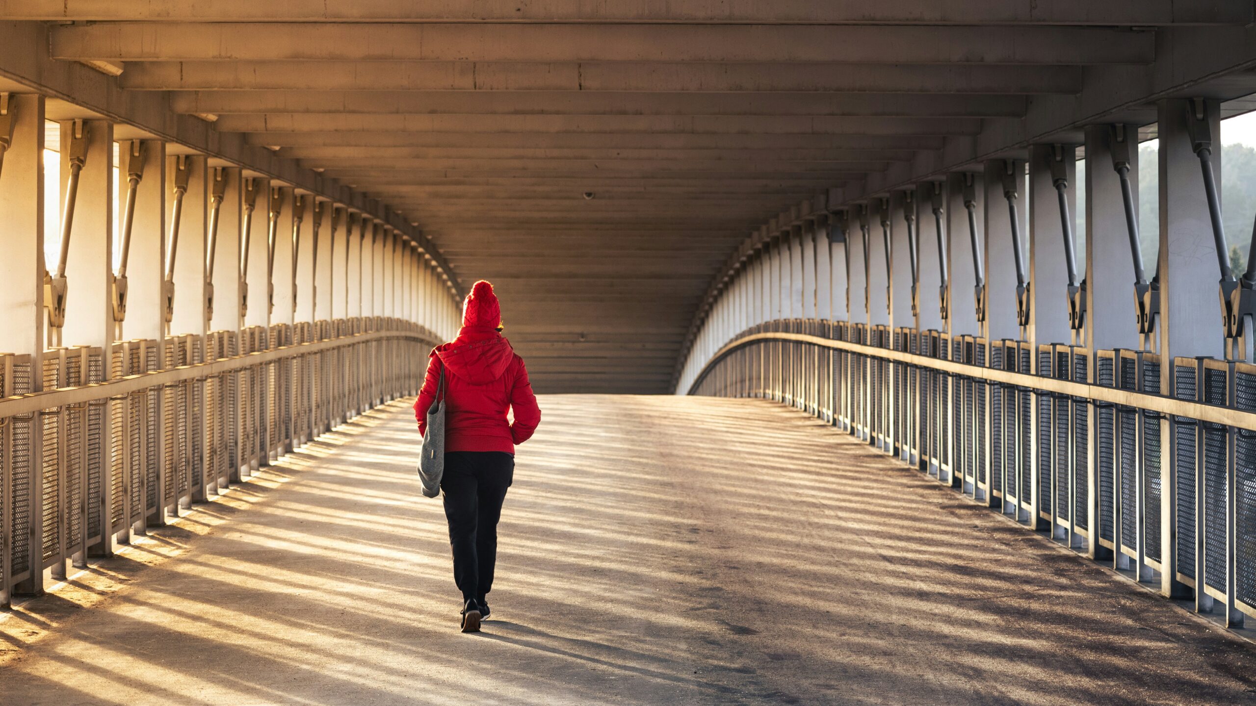 woman walking on a bridge