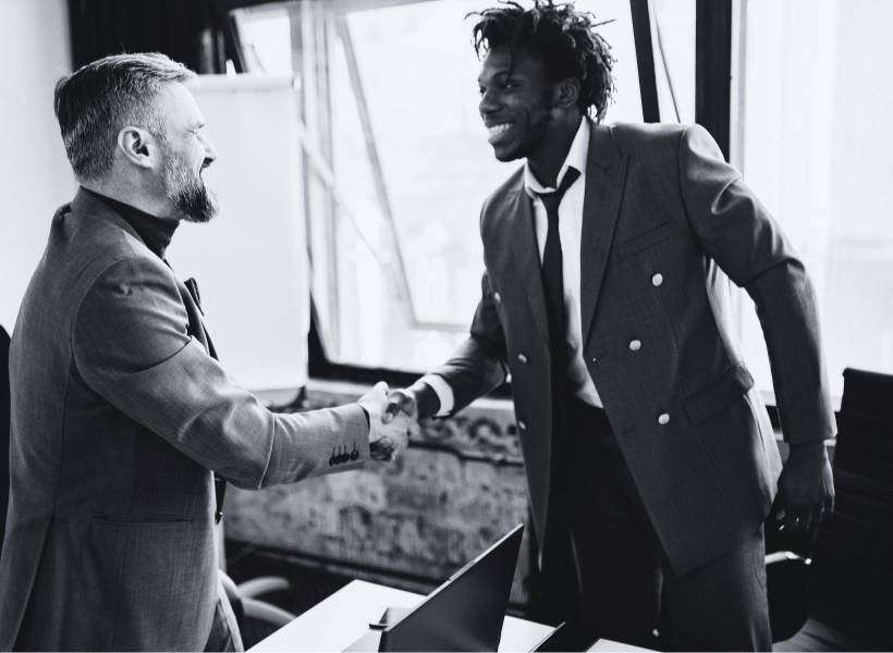 two men shaking hands - franchise business consultant