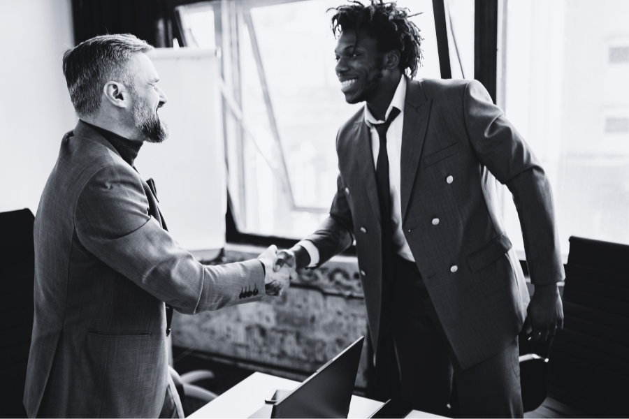 two men shaking hands - franchise business consultant